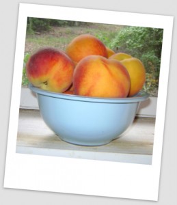 peaches in blue bowl